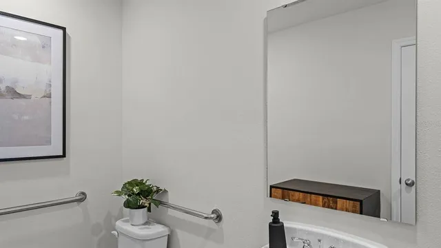 a bedroom with a bed and a dresser in it