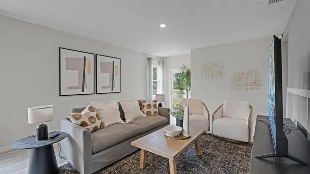 a living room with furniture and a window