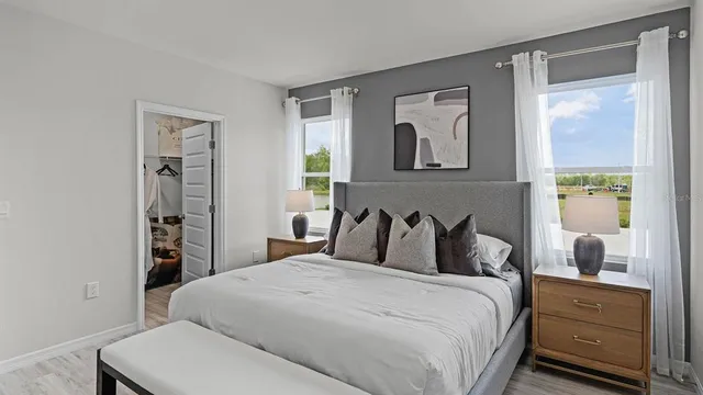 a bedroom with a bed and a closet