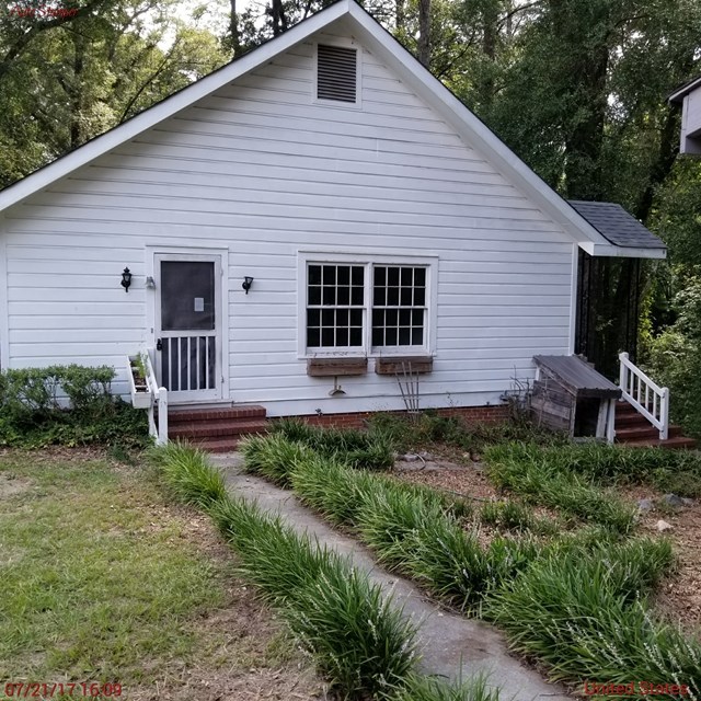 705 Charlse Drive Perry, GA 31069 - Photo 18 of 20 a view of a house with a yard and plants