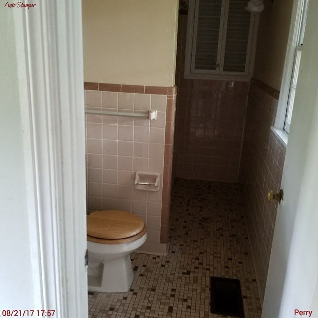 705 Charlse Drive Perry, GA 31069 - Photo 9 of 20 a bathroom with a toilet and a shower