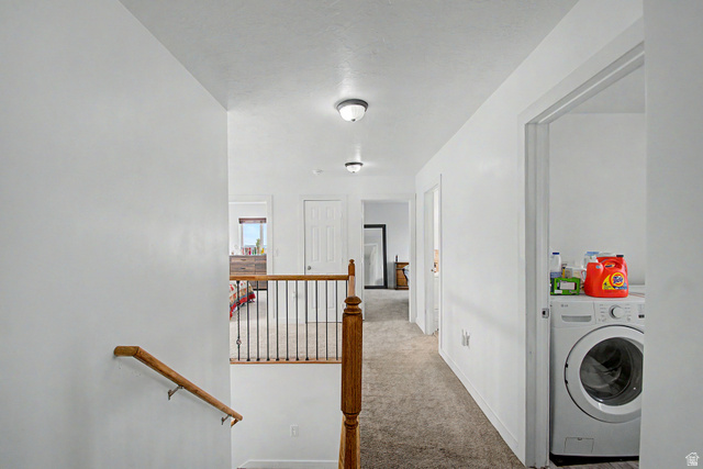 12645 East Cedar Ridge Drive Fairview, UT 84629 - Photo 9 of 34 Upper-level hallway featuring neutral carpeting, white walls, and recessed lighting