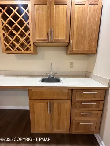 a living room with furniture large window and a flat screen tv
