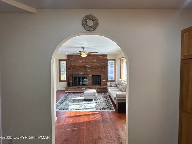 a living room with furniture and a rug