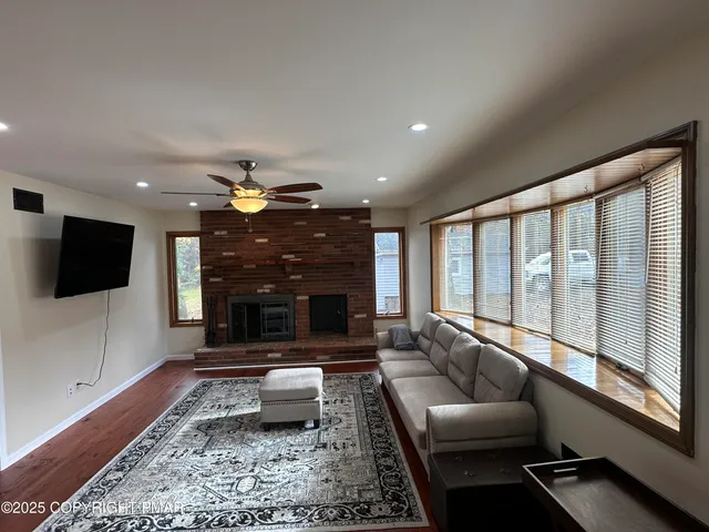 a living room with furniture and a rug