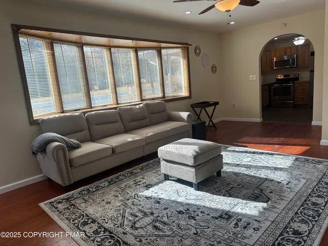 a view of a livingroom with furniture and wooden floor