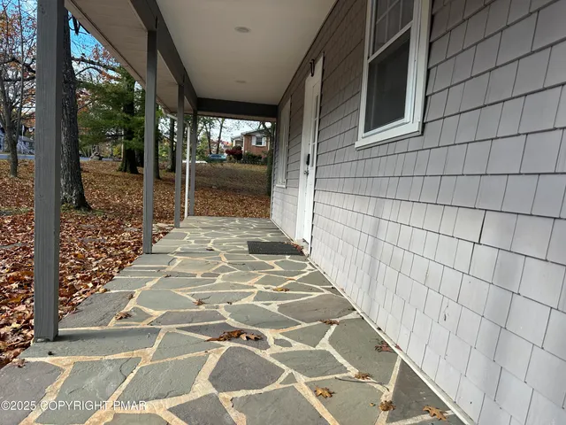 a view of a pathway door with wooden floor