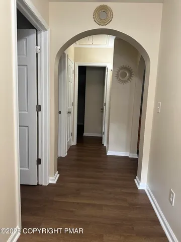 a kitchen with stainless steel appliances granite countertop a refrigerator a sink dishwasher a stove and a refrigerator