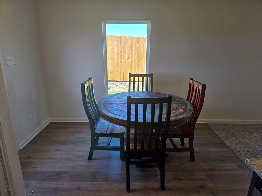 8425 Wibaux Road Ponder, TX 76259 - Photo 12 of 25 a view of a dining room with furniture and window