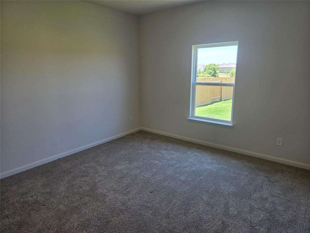 8425 Wibaux Road Ponder, TX 76259 - Photo 15 of 25 an empty room with a window