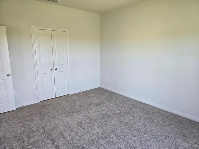 a view of an empty room and entryway