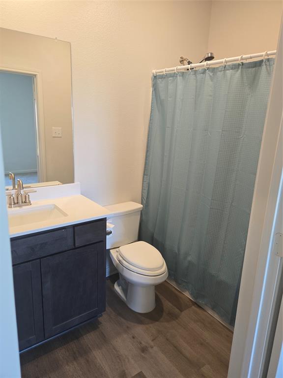 8425 Wibaux Road Ponder, TX 76259 - Photo 17 of 25 a bathroom with a sink and a toilet