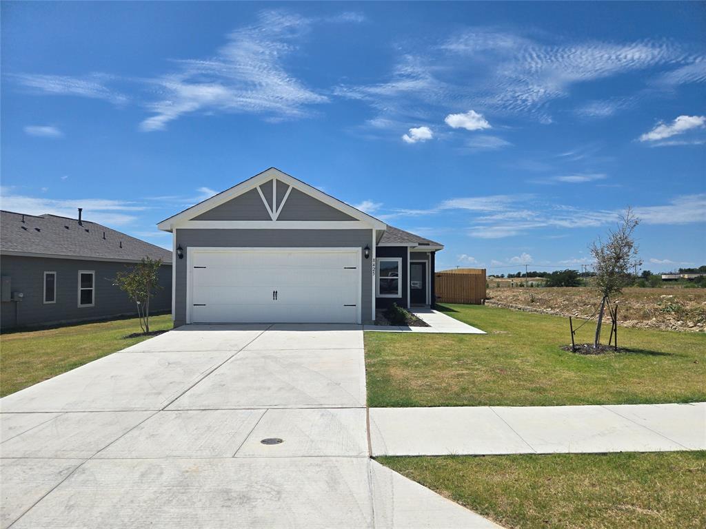 8425 Wibaux Road Ponder, TX 76259 - Photo 2 of 25 a front view of a house with a yard