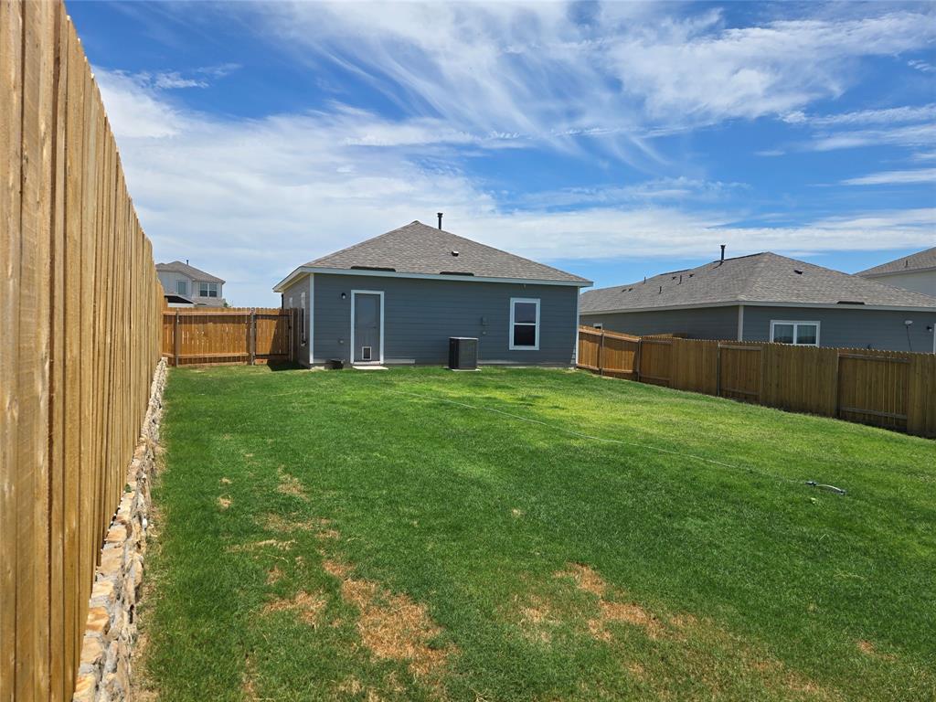 8425 Wibaux Road Ponder, TX 76259 - Photo 4 of 25 a front view of a house with garden