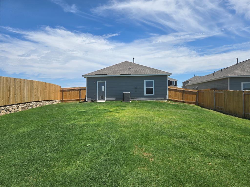 8425 Wibaux Road Ponder, TX 76259 - Photo 5 of 25 a front view of a house with a garden