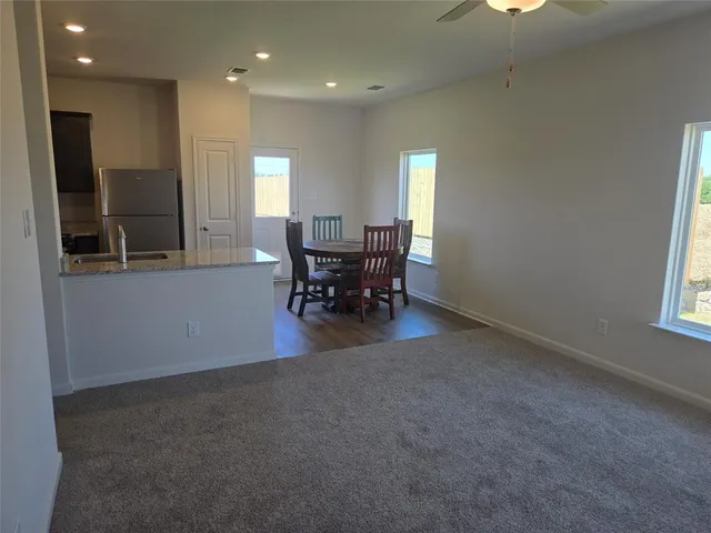 a view of a dining room with furniture