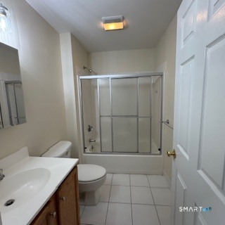 670 Boston Post Road, Unit 18 Milford, CT 06460 - Photo 14 of 18 a bathroom with a sink a toilet and shower