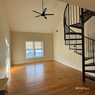 670 Boston Post Road, Unit 18 Milford, CT 06460 - Photo 2 of 18 a view of an empty room with wooden floor and a window