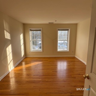 670 Boston Post Road, Unit 18 Milford, CT 06460 - Photo 4 of 18 a view of an empty room with window