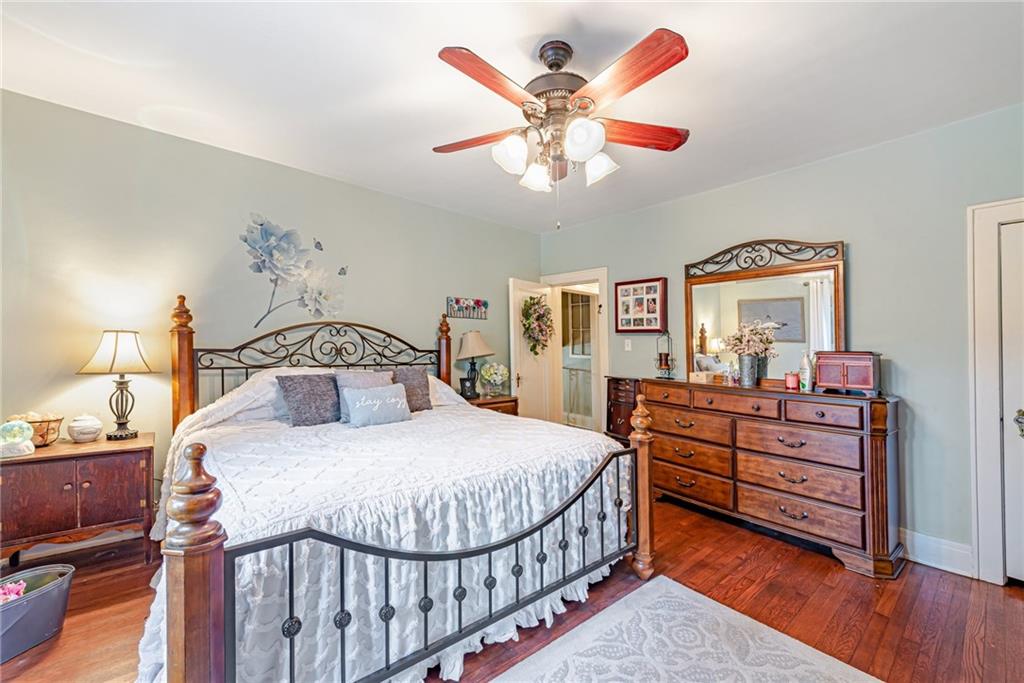 1100 State Rt 30 Laughlintown, PA 15655 - Photo 26 of 50 a bedroom with a bed and a chandelier
