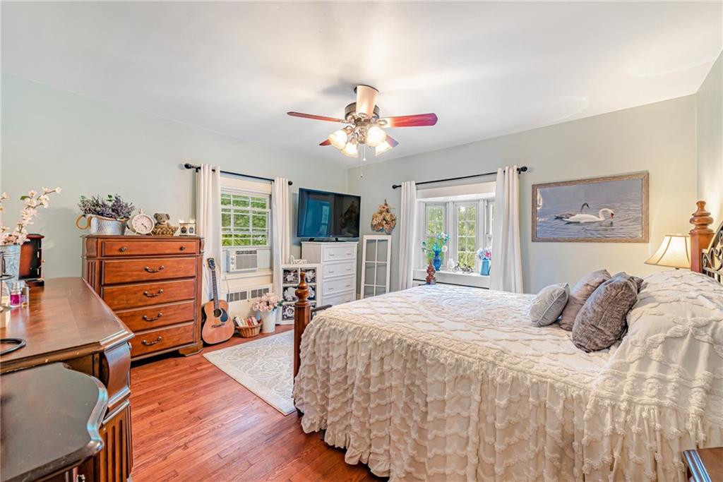 1100 State Rt 30 Laughlintown, PA 15655 - Photo 27 of 50 a bedroom with a bed and wooden floor