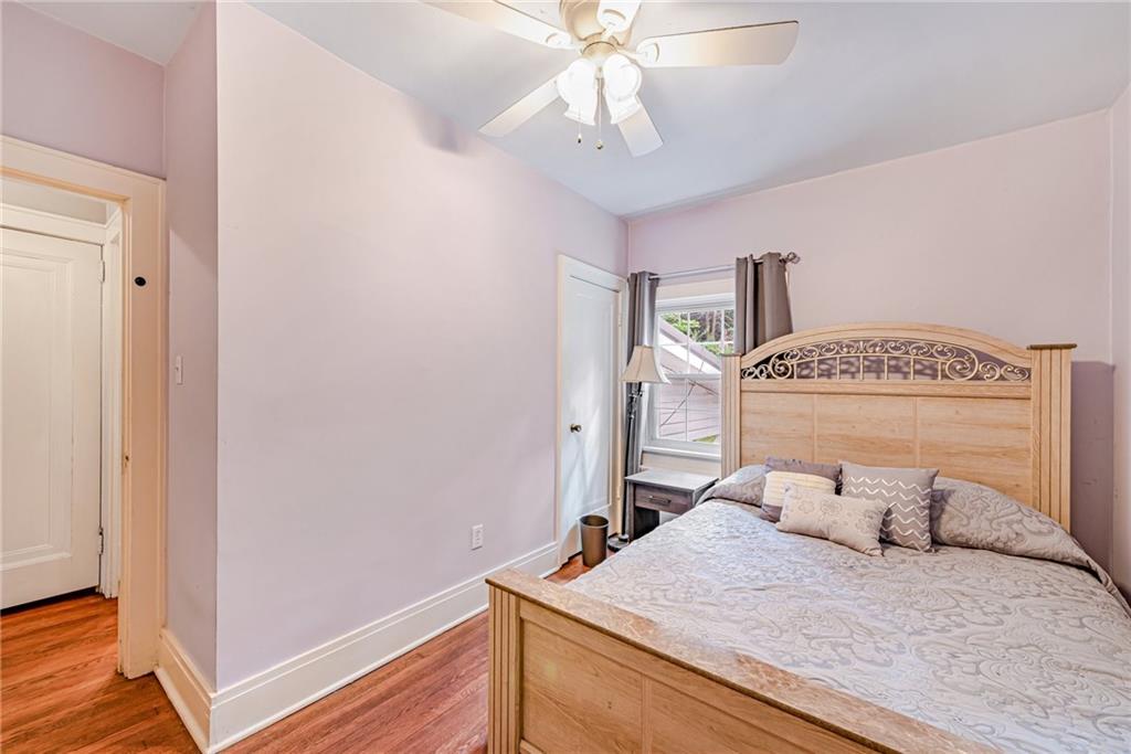 1100 State Rt 30 Laughlintown, PA 15655 - Photo 30 of 50 a bedroom with a bed and a chandelier