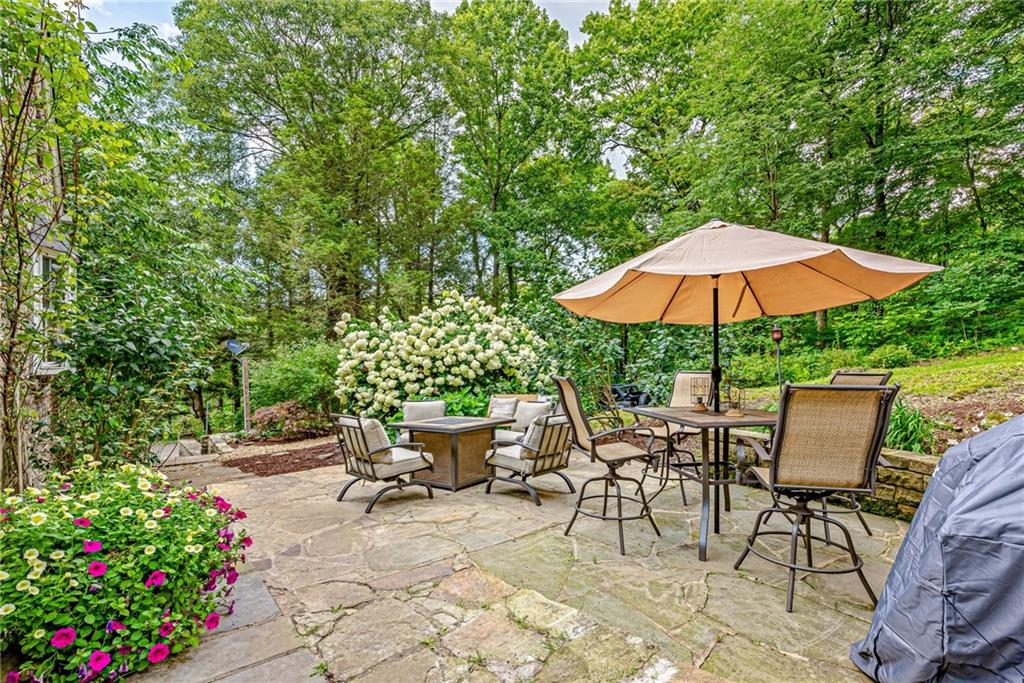 1100 State Rt 30 Laughlintown, PA 15655 - Photo 7 of 50 a view of backyard with seating space and wooden fence
