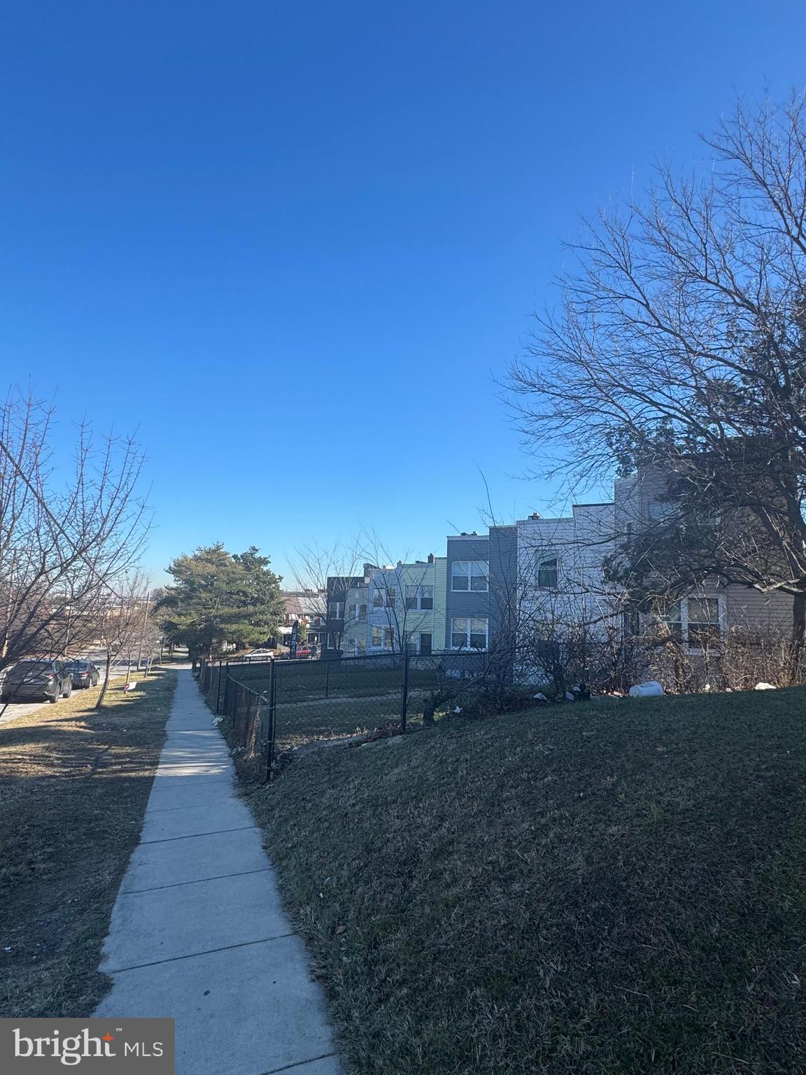 515 Cherry Hill Road Baltimore, MD 21225 - Photo 2 of 62 a view of a pathway with a wrought fence