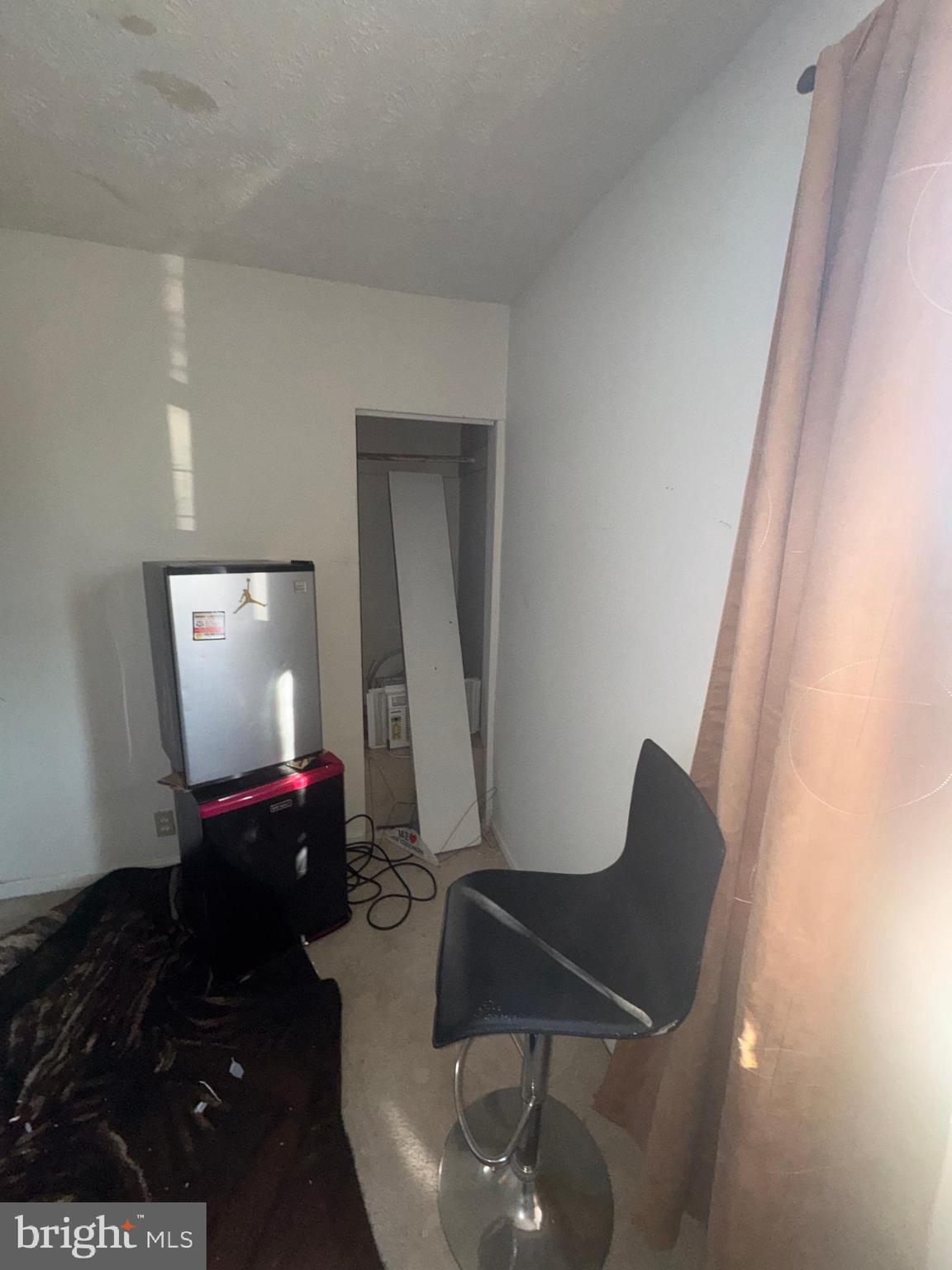 515 Cherry Hill Road Baltimore, MD 21225 - Photo 39 of 62 a living room with furniture and a flat screen tv