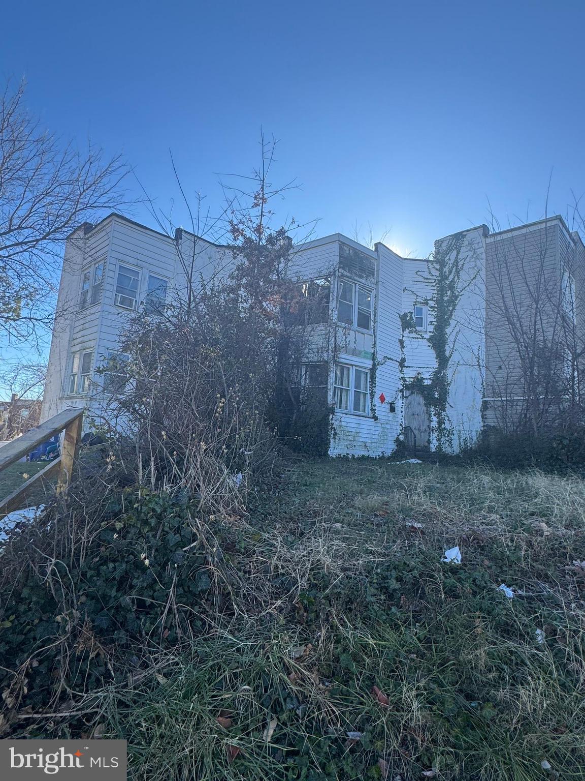515 Cherry Hill Road Baltimore, MD 21225 - Photo 5 of 62 a view of a dry yard with wooden fence