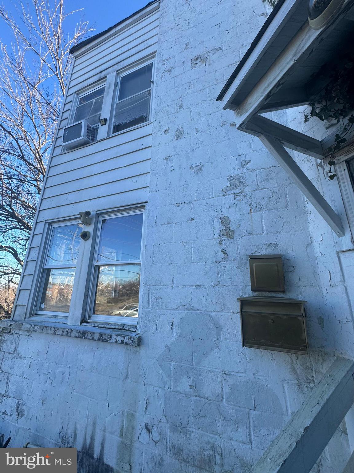 515 Cherry Hill Road Baltimore, MD 21225 - Photo 10 of 62 a front view of a house with stairs