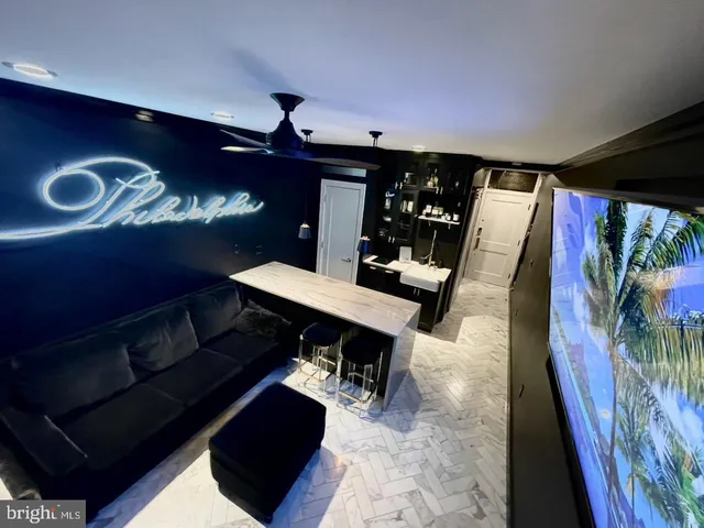 a view of a couches and dinning table in a room