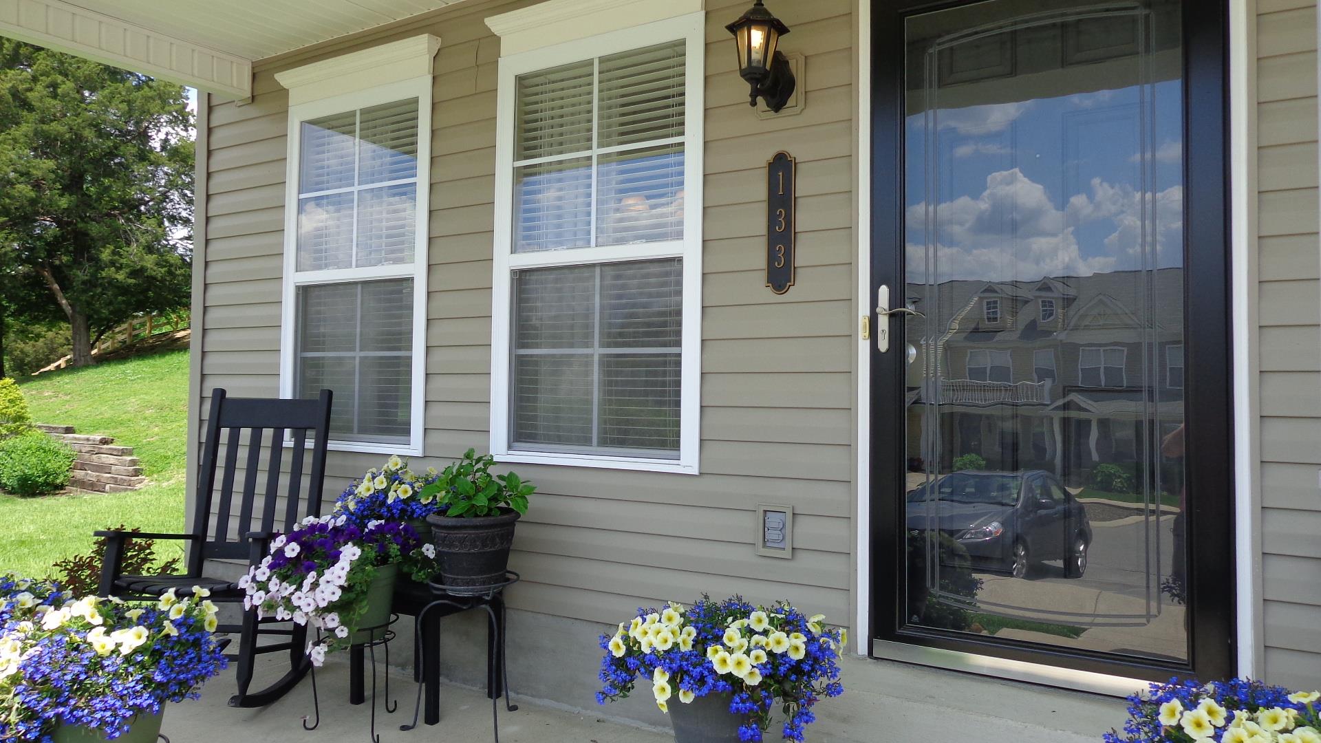 1382 Rural Hill Road, Unit 133 Antioch, TN 37013 - Photo 2 of 18 a vase of flowers sitting on a glass door