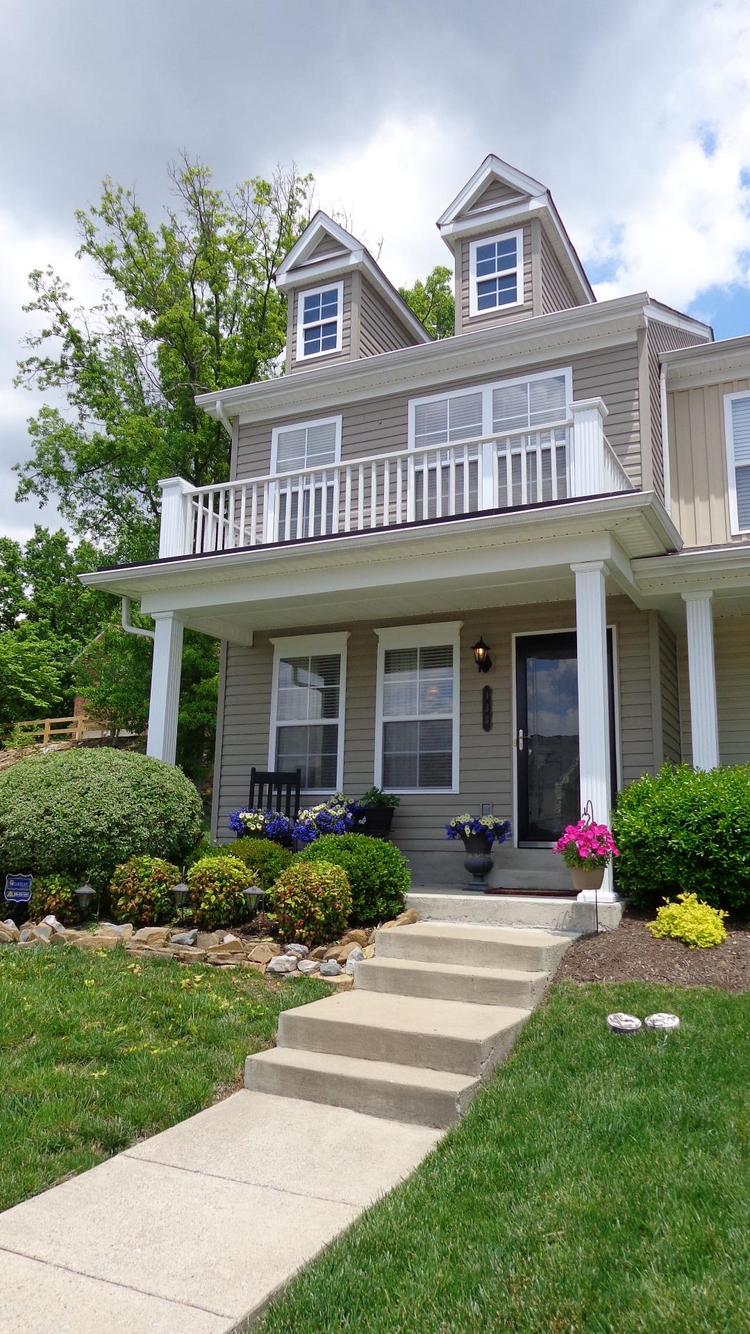 1382 Rural Hill Road, Unit 133 Antioch, TN 37013 - Photo 3 of 18 a front view of a house with a yard