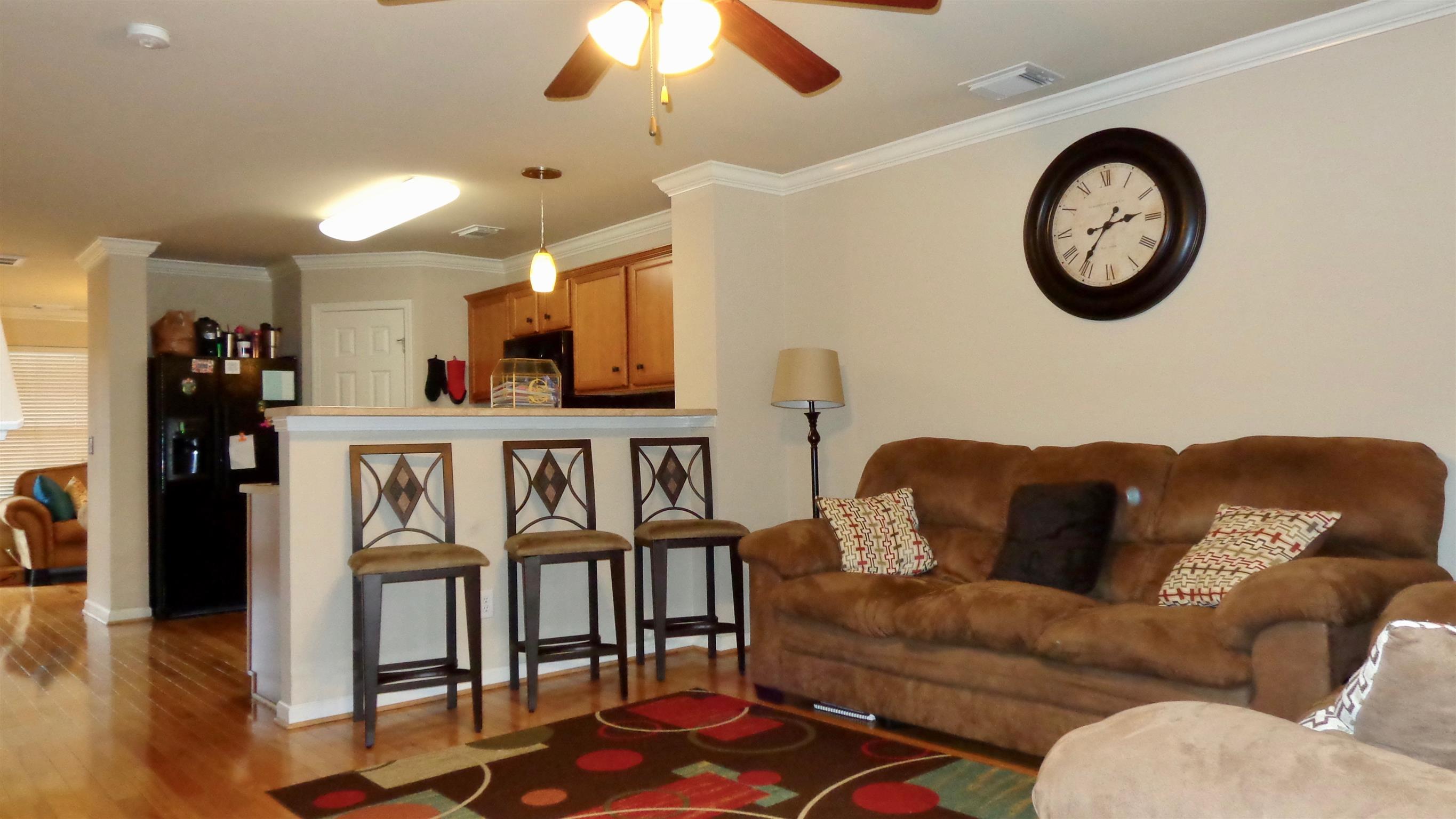 1382 Rural Hill Road, Unit 133 Antioch, TN 37013 - Photo 5 of 18 a living room with furniture a flat screen tv and a wall painting