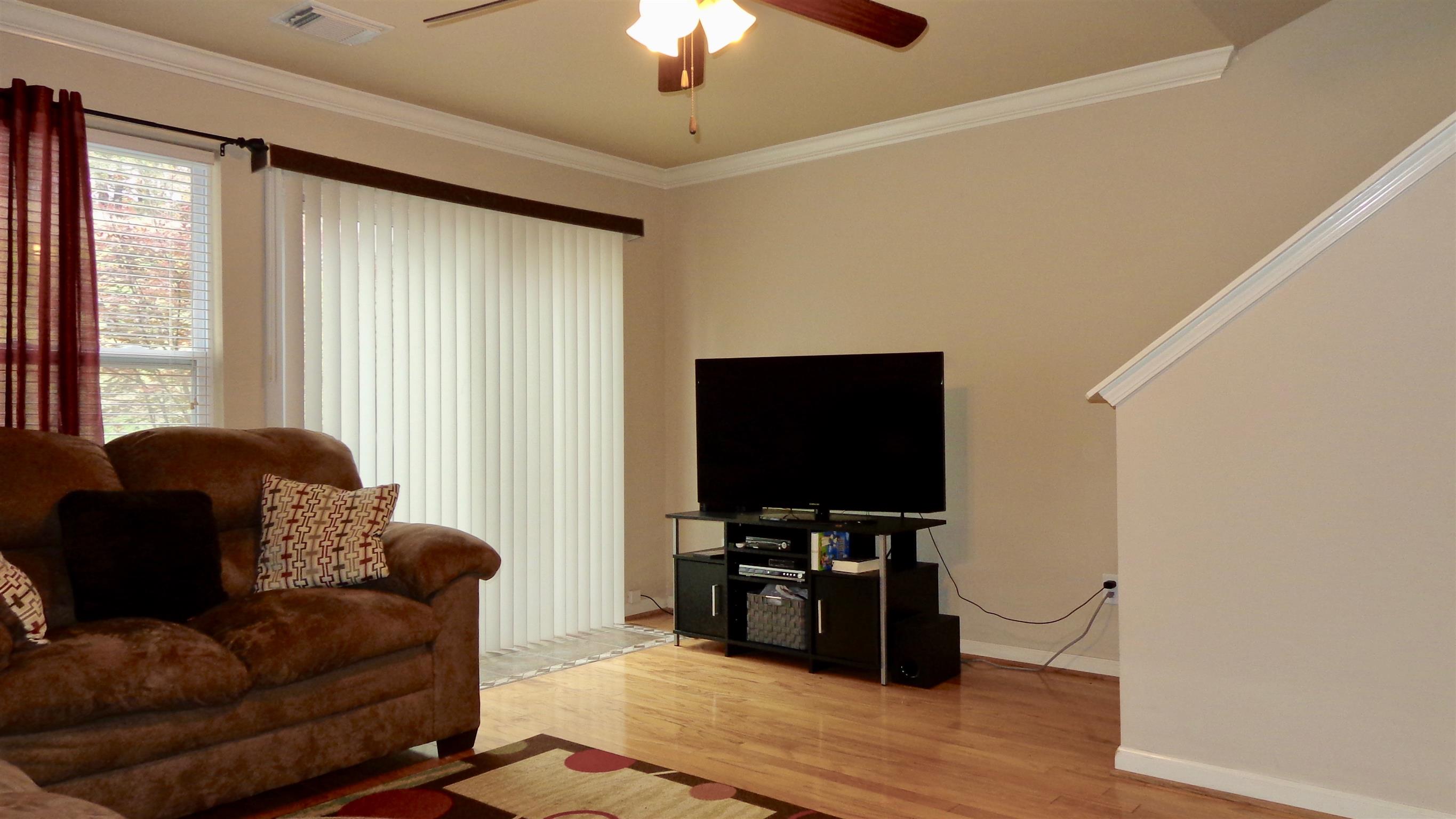 1382 Rural Hill Road, Unit 133 Antioch, TN 37013 - Photo 7 of 18 a living room with furniture and a flat screen tv