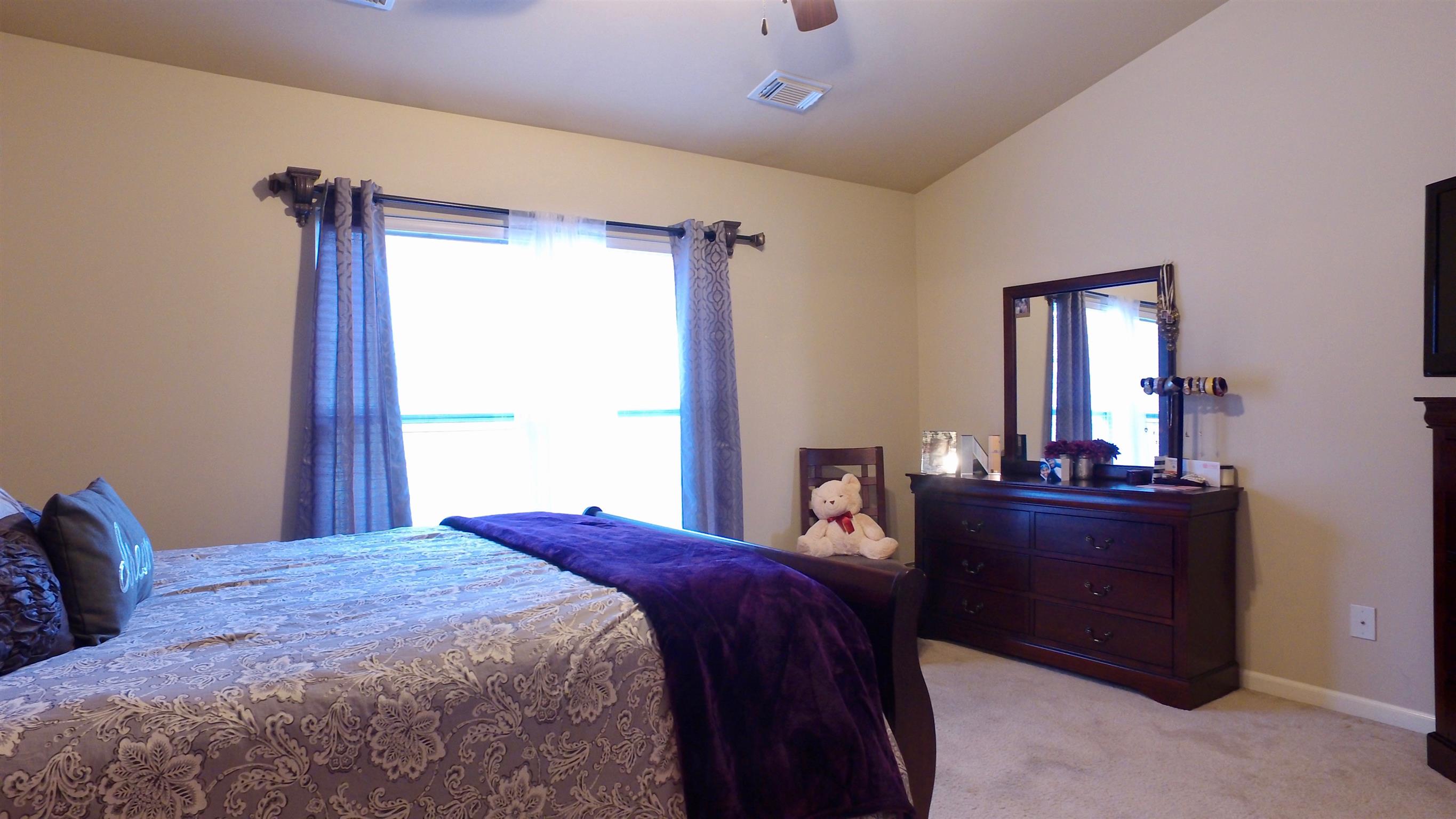 1382 Rural Hill Road, Unit 133 Antioch, TN 37013 - Photo 10 of 18 a bed room with a bed and a dresser