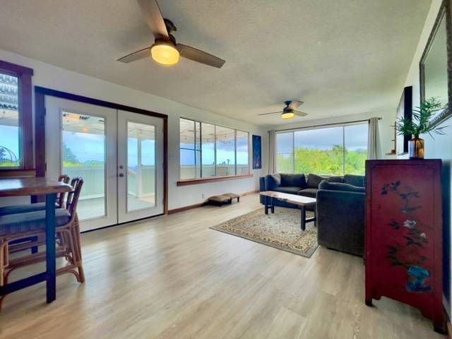 81-1010 St John's Road Kealakekua, HI 96750 - Photo 11 of 30 a living room with furniture and a window