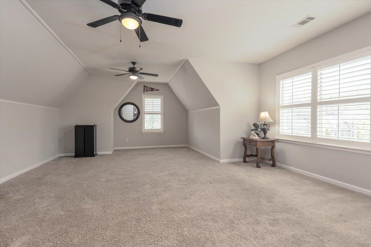 608 Cypress Run Cove Collierville, TN 38017 - Photo 25 of 40 Additional living space featuring lofted ceiling, light colored carpet, and ceiling fan