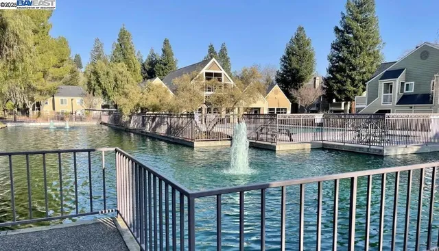 a view of swimming pool from a balcony