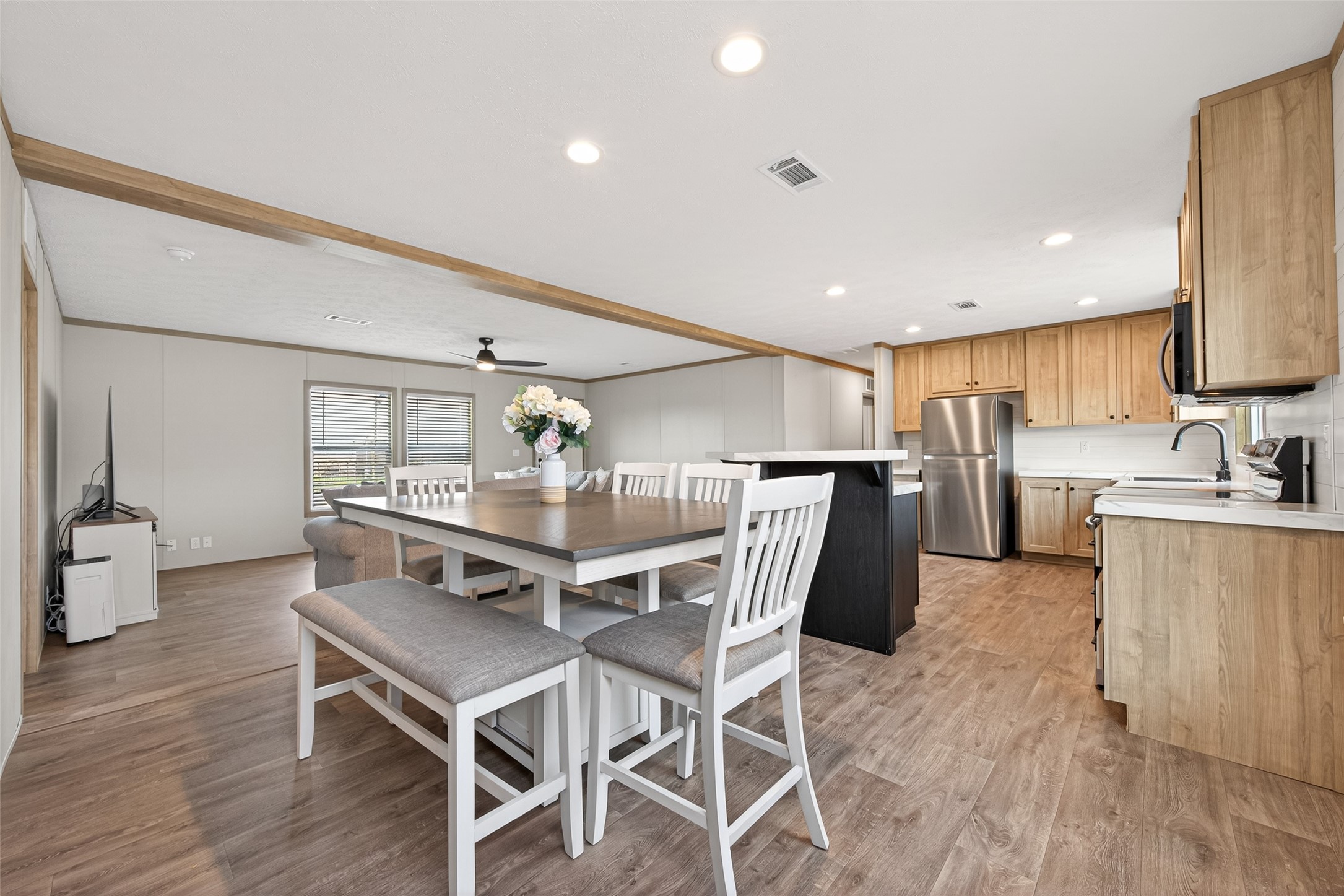 1218 Longleaf Pne Street Huffman, TX 77336 - Photo 11 of 29 Alternate angle showing the dining space’s integration within the open-concept layout, enhancing flow and usability.