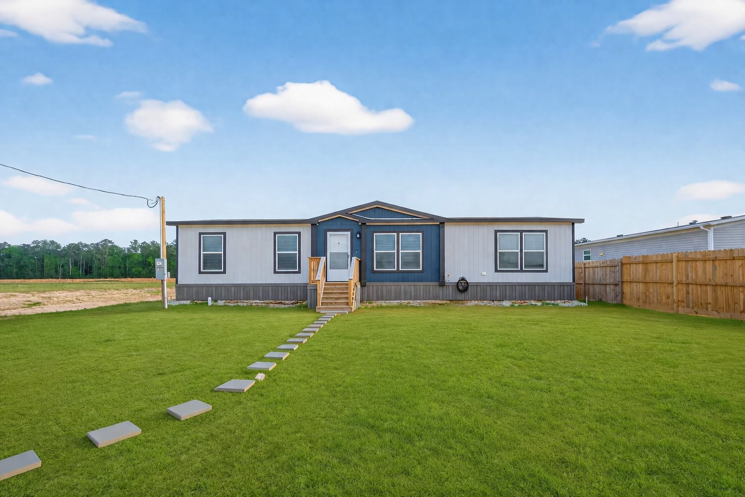 1218 Longleaf Pne Street Huffman, TX 77336 - Photo 29 of 29 Front elevation of the property showcasing a spacious lot and clean exterior design.
Grass in images has been AI generated for visualization purposes.