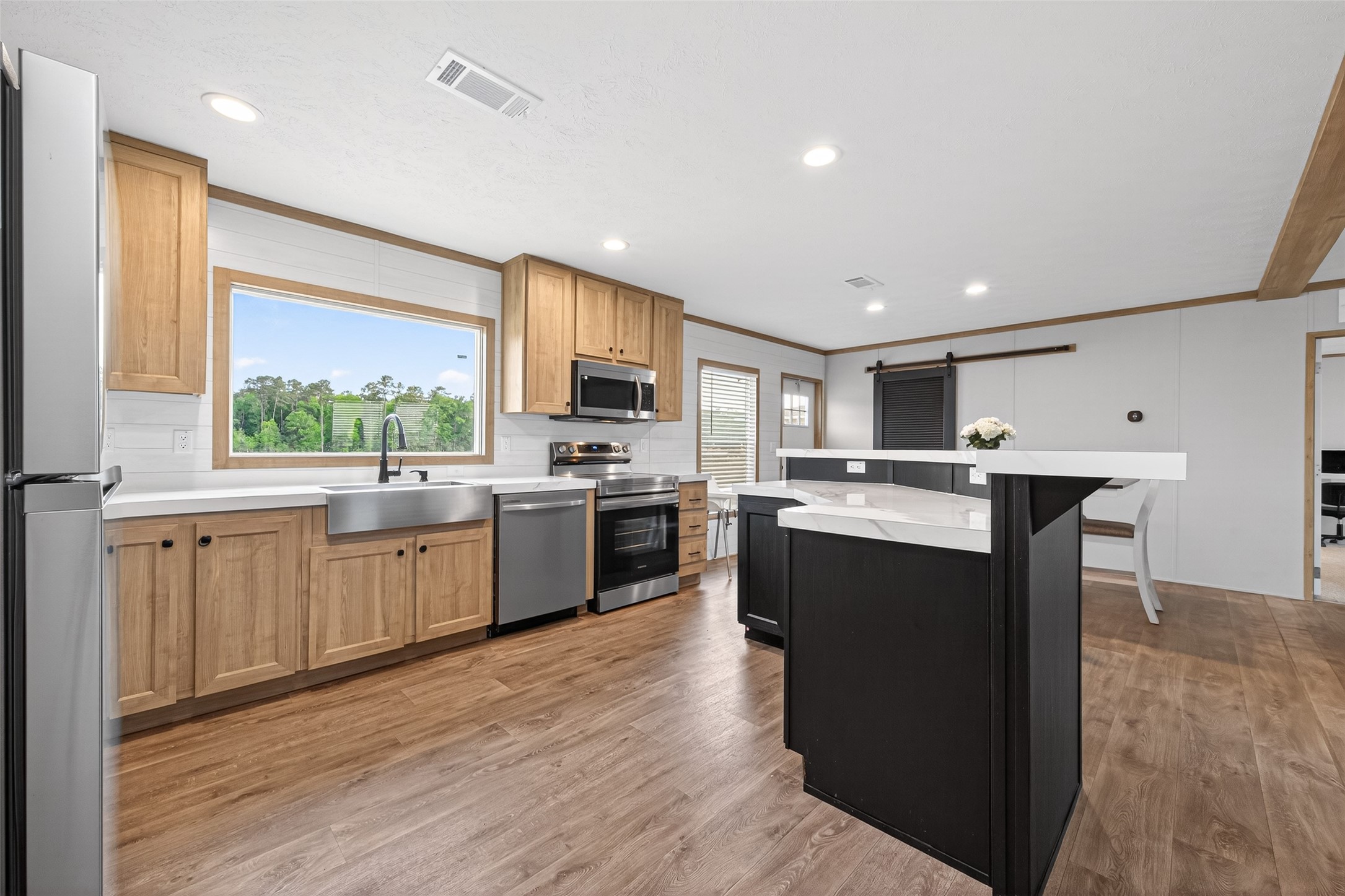 1218 Longleaf Pne Street Huffman, TX 77336 - Photo 4 of 29 Detail shot emphasizing cabinetry, island space, and overall flow of the kitchen