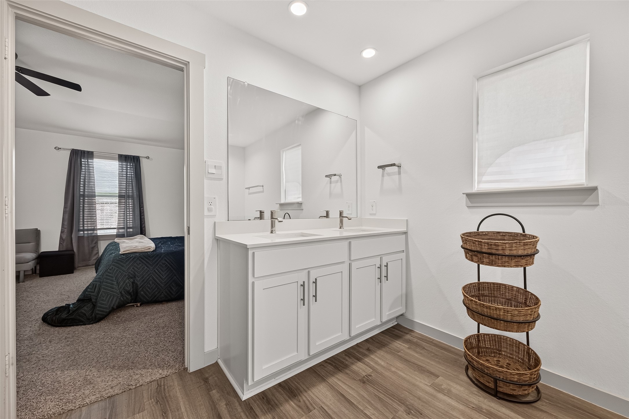 7923 Sleek Flock Lane Rosharon, TX 77583 - Photo 14 of 29 Bright and modern bathroom featuring a sleek double vanity with ample storage, complemented by stylish flooring and convenient access to the adjoining bedroom.