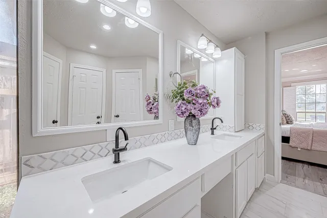 a bathroom with sink and mirror