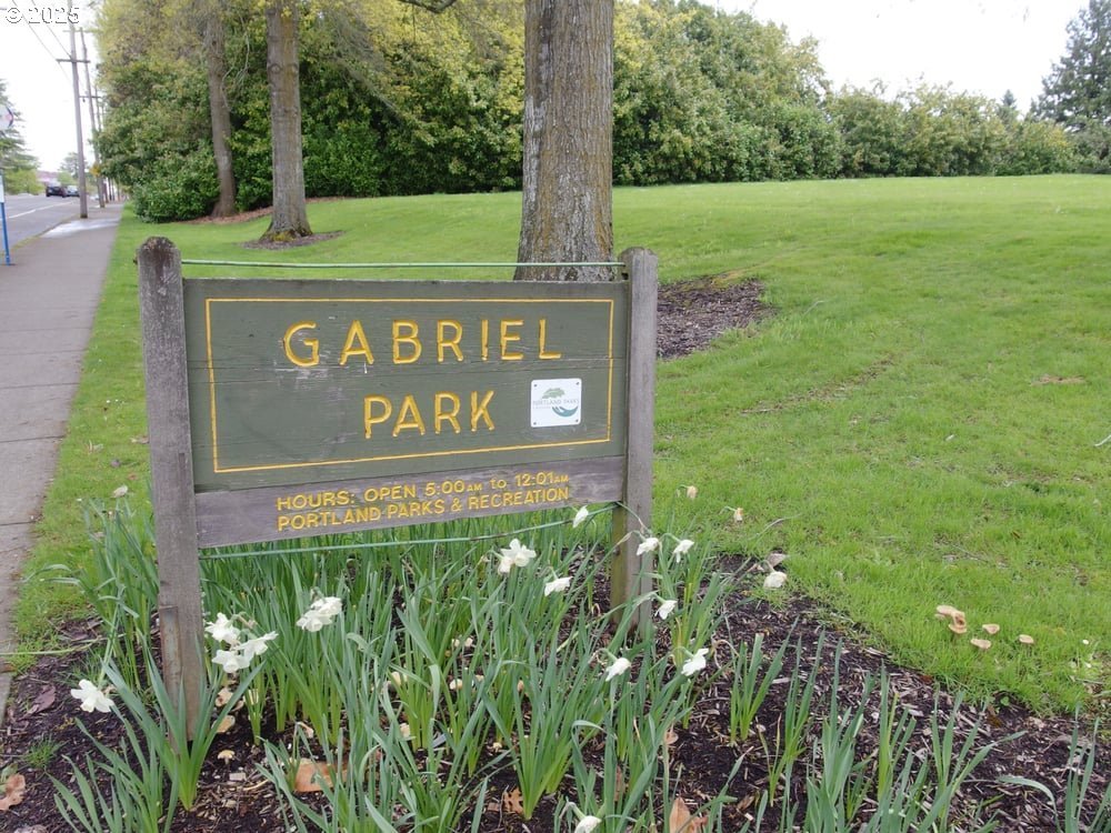 6518 Southwest 35th Avenue Portland, OR 97221 - Photo 31 of 36 a view of outdoor space with sign board and green space
