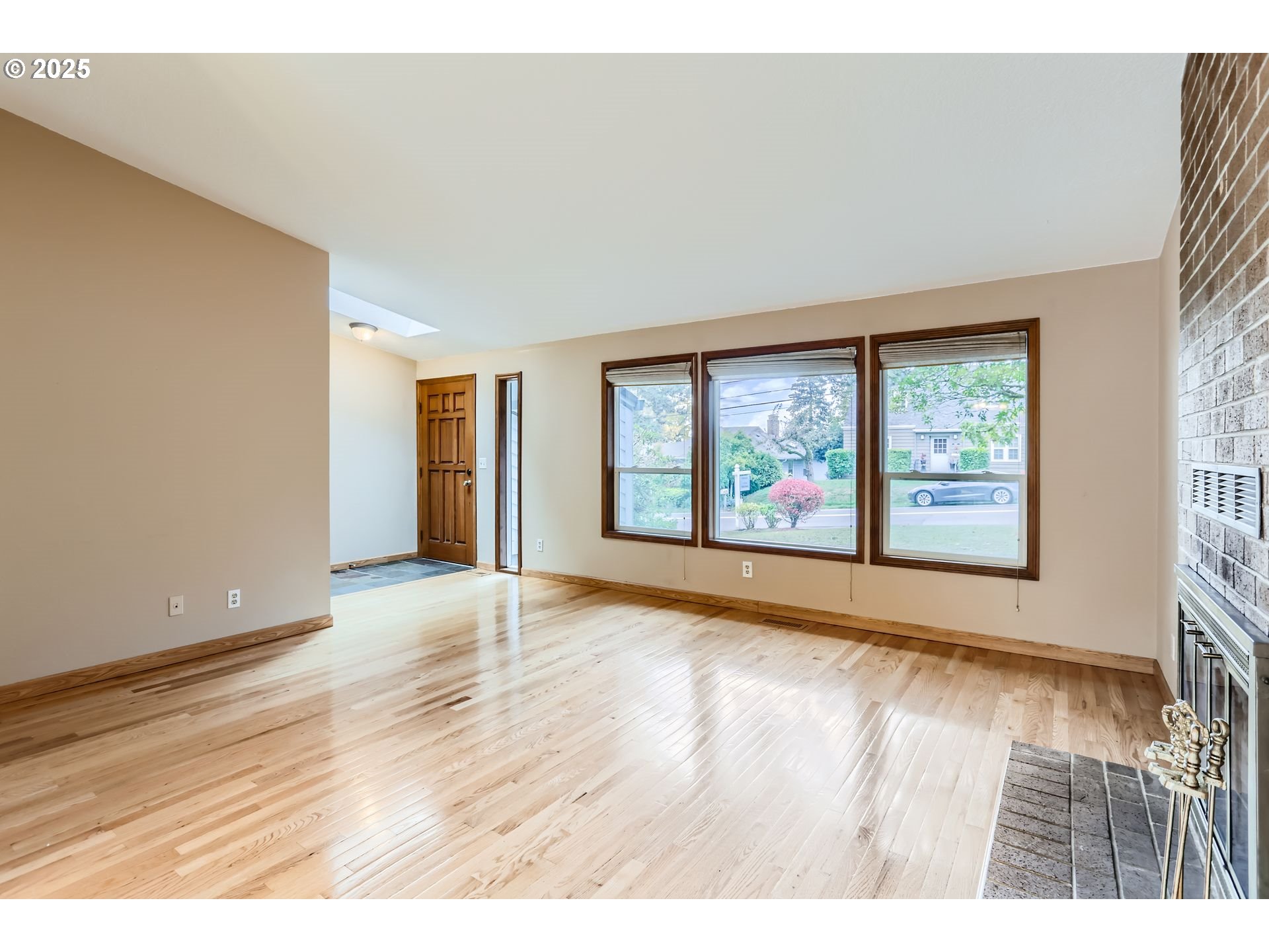 6518 Southwest 35th Avenue Portland, OR 97221 - Photo 8 of 36 an empty room with wooden floor and windows