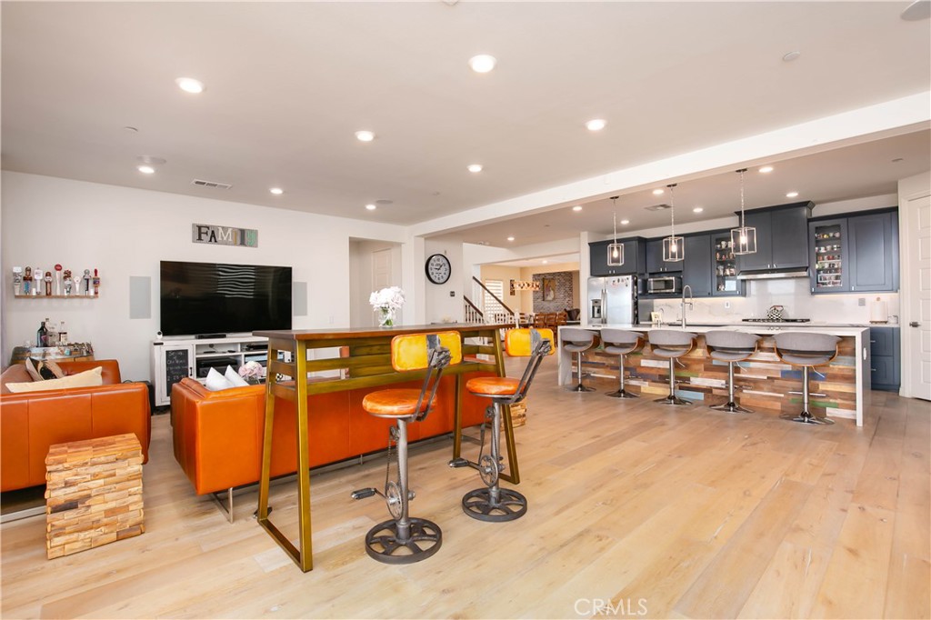 19680 Griffith Drive Saugus, CA 91350 - Photo 15 of 49 a living room with furniture and a flat screen tv