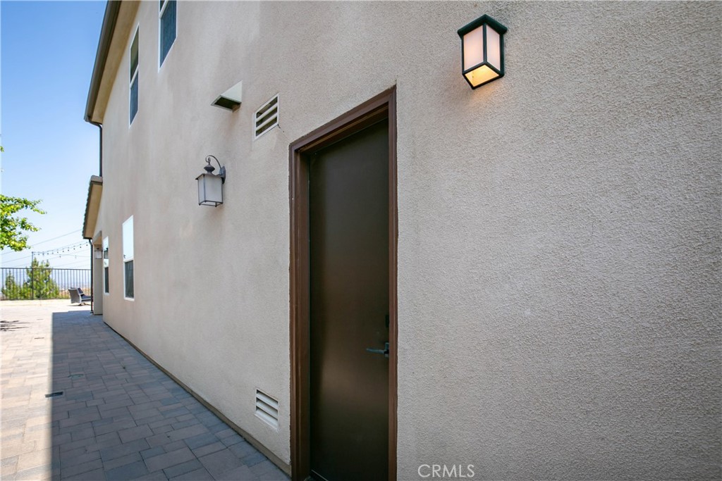 19680 Griffith Drive Saugus, CA 91350 - Photo 20 of 49 a view of a hallway with wooden floor and a bathroom view