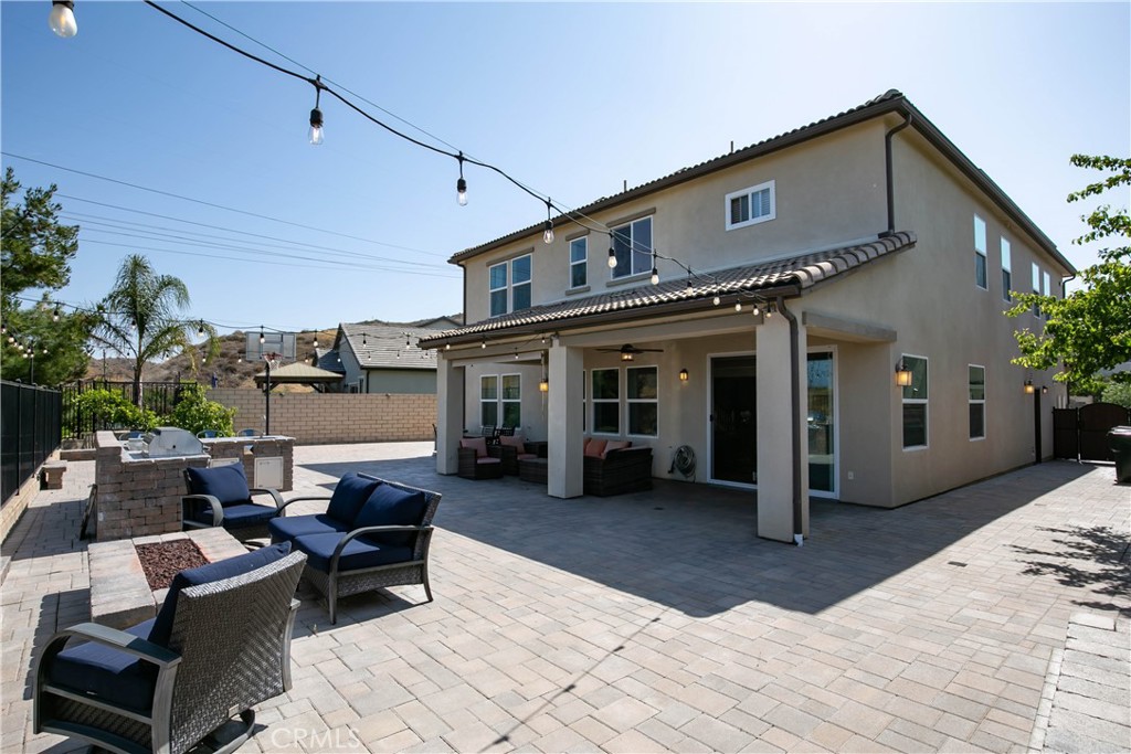 19680 Griffith Drive Saugus, CA 91350 - Photo 26 of 49 a patio with furniture and a yard